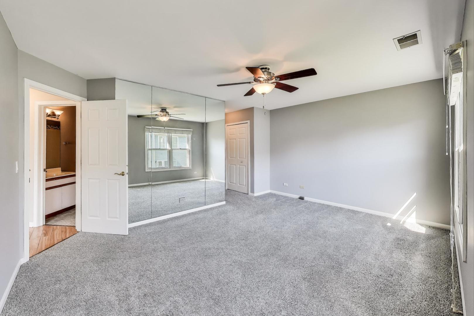 914 Prospect Court, Unit 914 Naperville, IL 60540 - Photo 17 of 38 a view of an empty room with a window
