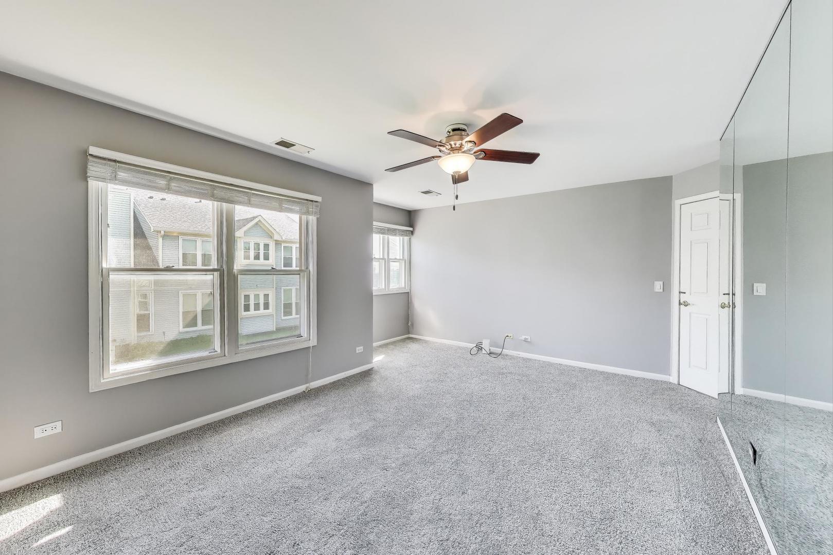 914 Prospect Court, Unit 914 Naperville, IL 60540 - Photo 18 of 38 a view of an empty room with a window