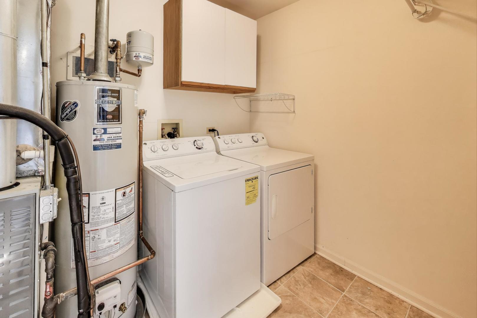 914 Prospect Court, Unit 914 Naperville, IL 60540 - Photo 25 of 38 a utility room with dryer and washer
