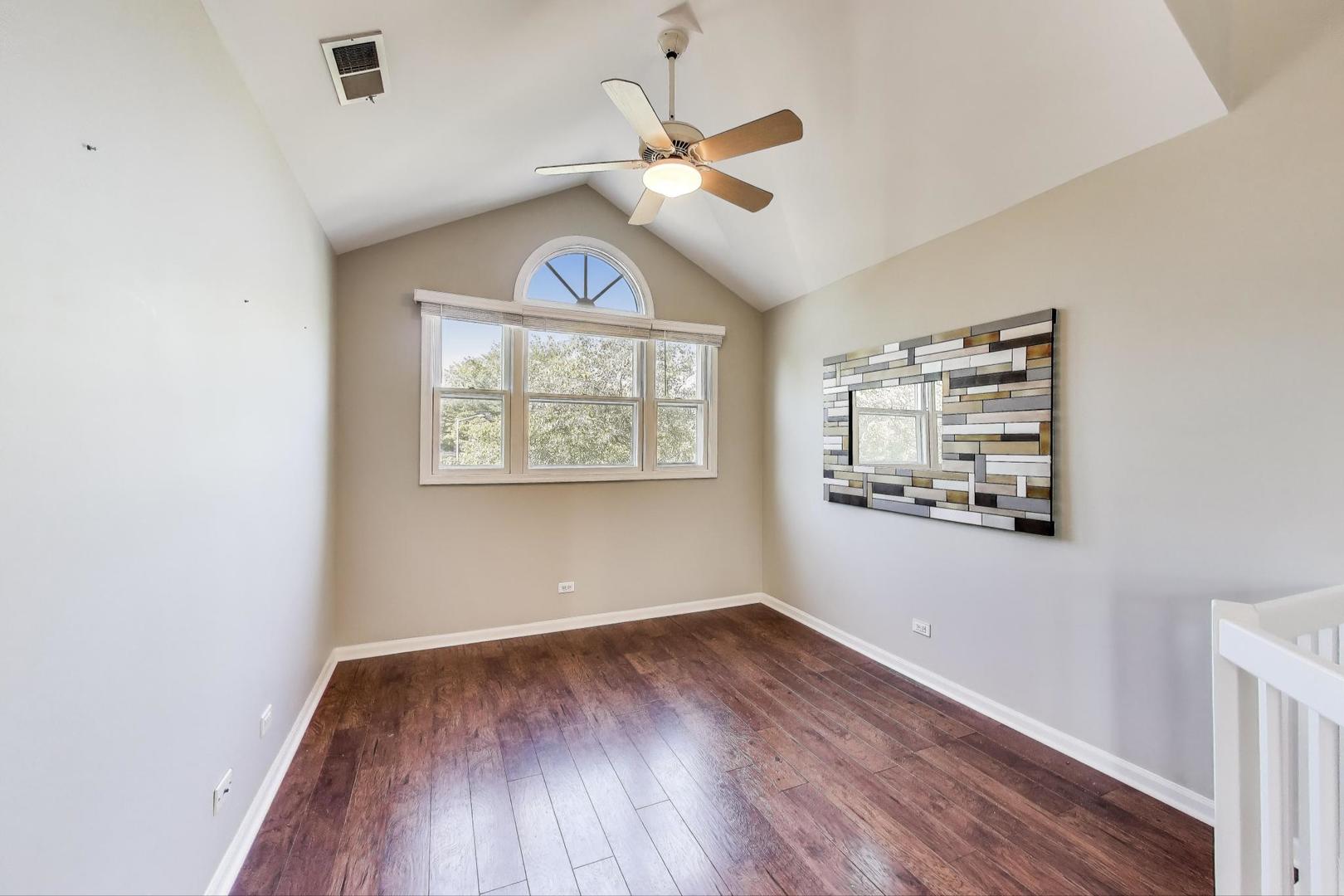 914 Prospect Court, Unit 914 Naperville, IL 60540 - Photo 10 of 38 wooden floor in an empty room with a window