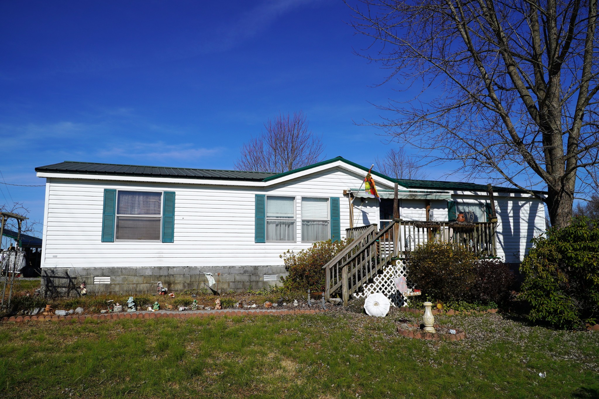 680 Howell Hill Road Flintville, TN 37335 - Photo 1 of 48 a front view of a house with a yard