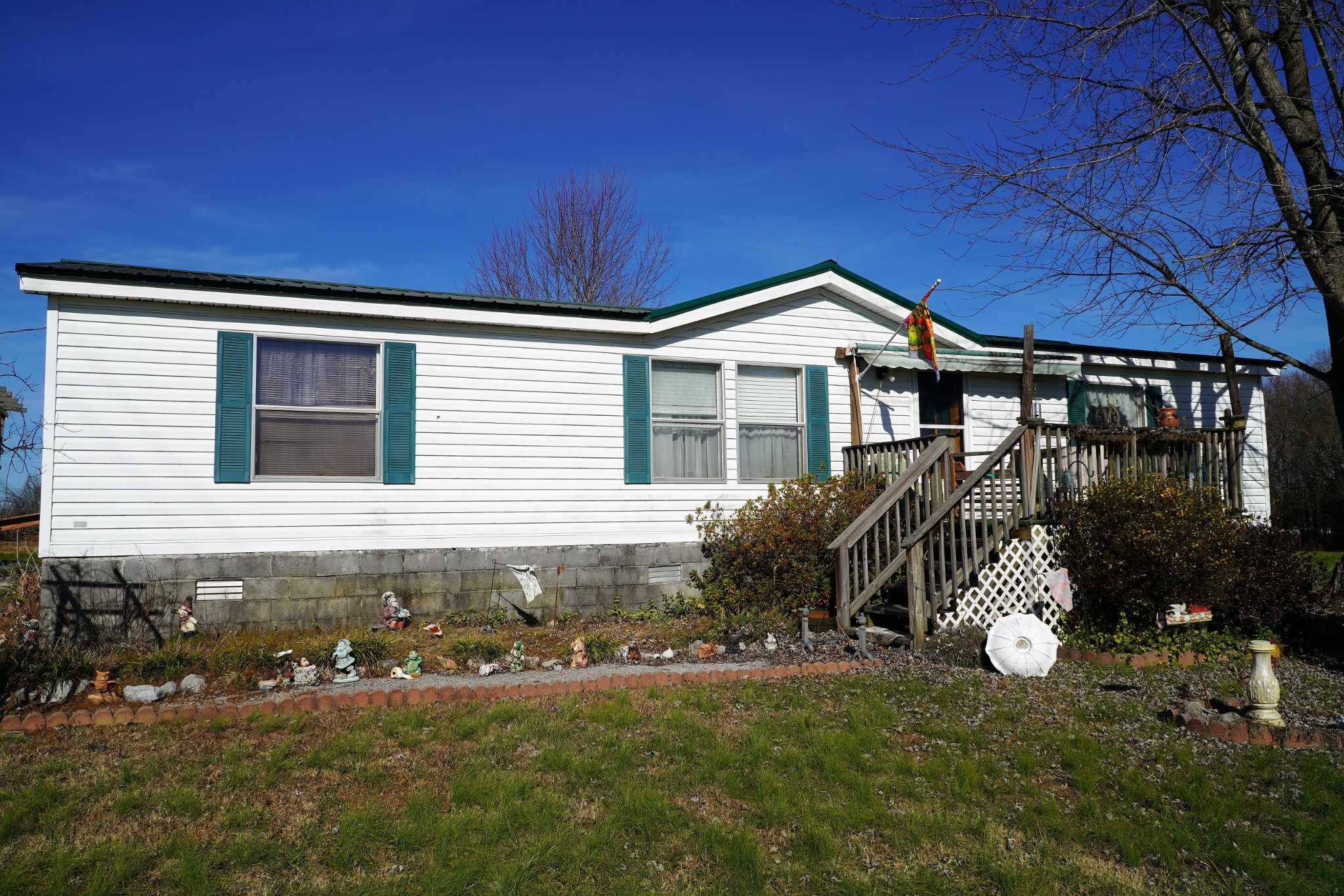 680 Howell Hill Road Flintville, TN 37335 - Photo 2 of 48 a front view of a house with a yard