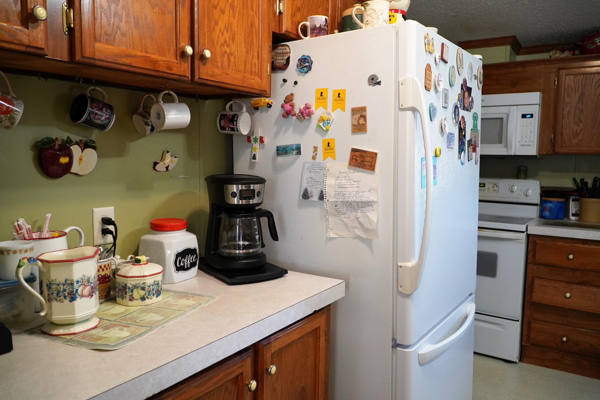 680 Howell Hill Road Flintville, TN 37335 - Photo 8 of 48 a kitchen with a refrigerator and cabinets