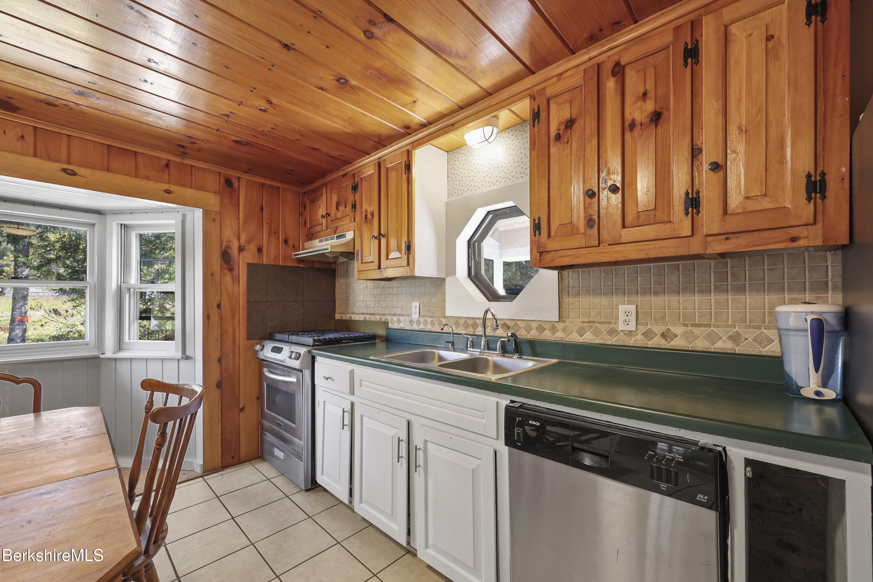 95 Water Farm Road Sheffield, MA 01257 - Photo 9 of 27 a kitchen with granite countertop a sink a stove and cabinets
