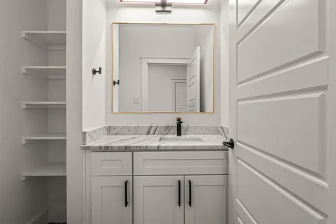 a bathroom with a sink and a mirror