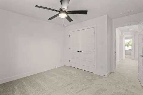 an empty room with fan