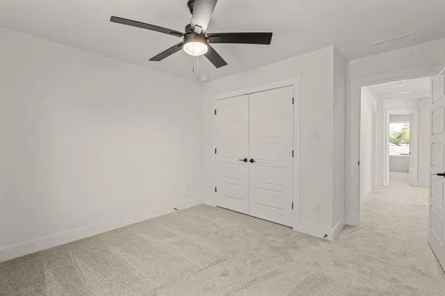 an empty room with fan