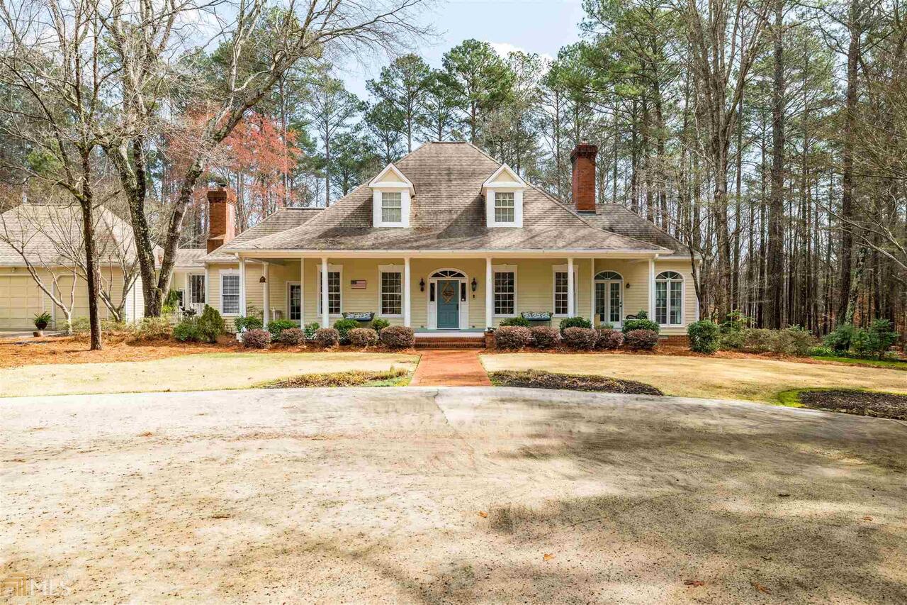 15 Orchard Spring Drive Southwest Rome, GA 30165 - Photo 1 of 1 a front view of a building with a garden