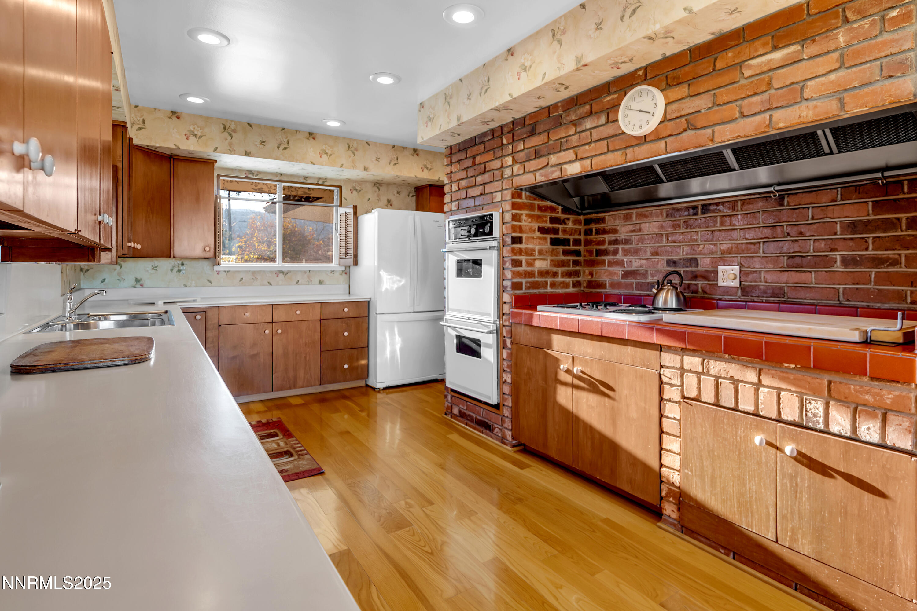 1965 Solari Drive Reno, NV 89509 - Photo 13 of 44 a kitchen with stainless steel appliances granite countertop a sink and cabinets