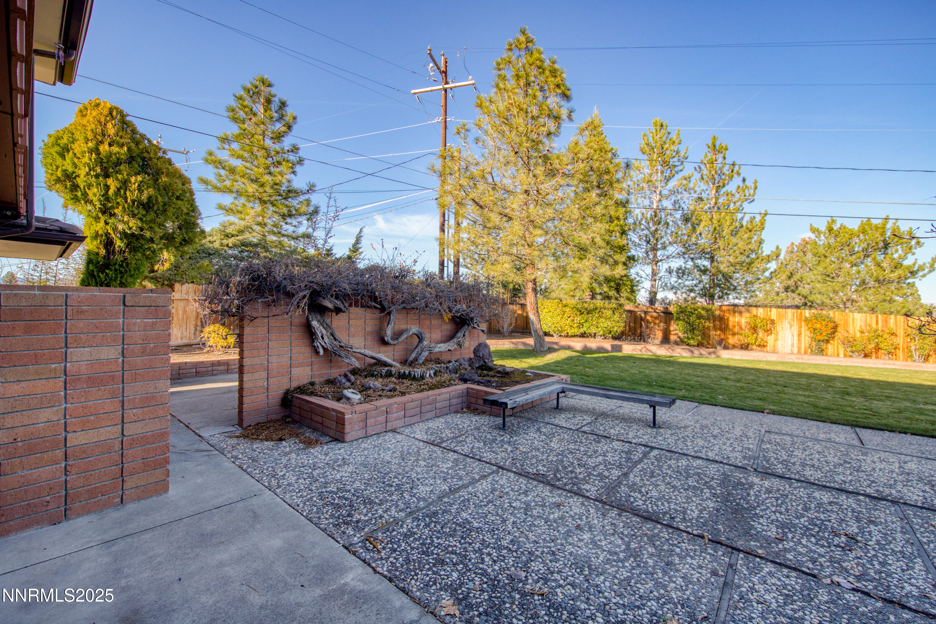 1965 Solari Drive Reno, NV 89509 - Photo 35 of 44 a view of backyard with a table and chairs and potted plants