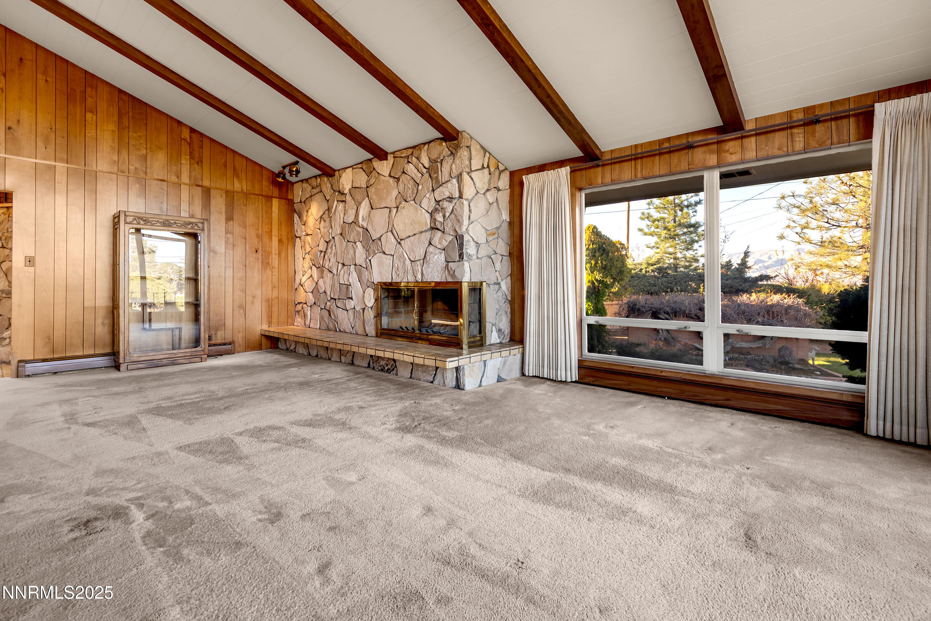 1965 Solari Drive Reno, NV 89509 - Photo 9 of 44 a view of empty room with floor to ceiling window and fireplace