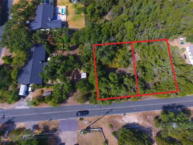 an aerial view of city and lake