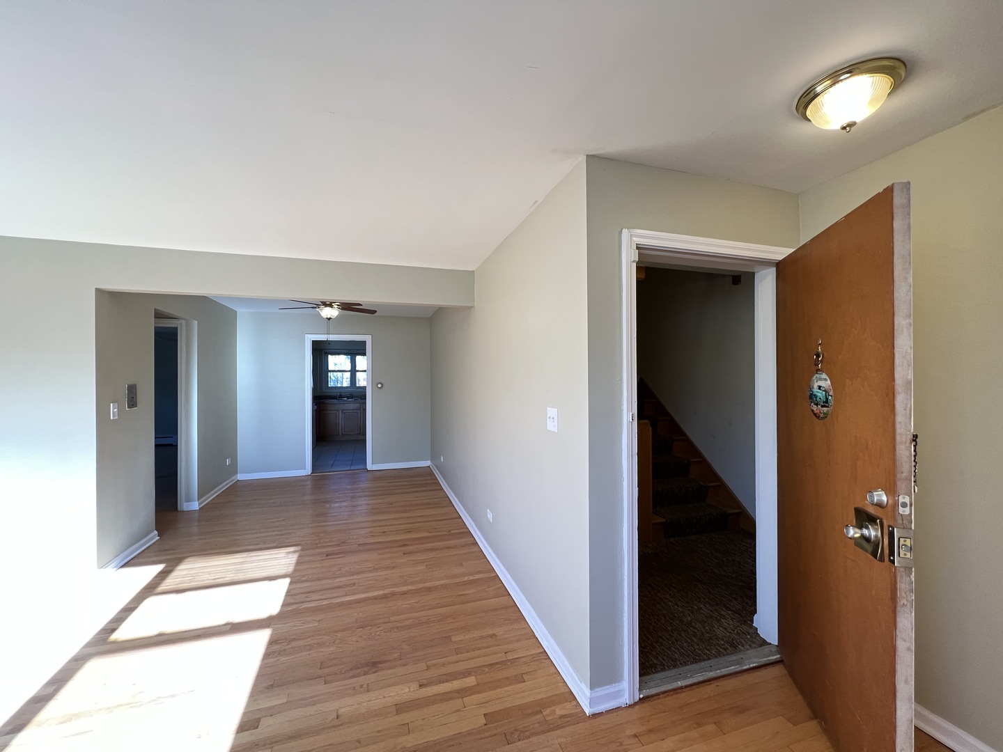 560 Princeton Street, Unit A2W Des Plaines, IL 60016 - Photo 5 of 15 a view of a hallway with wooden floor and closet
