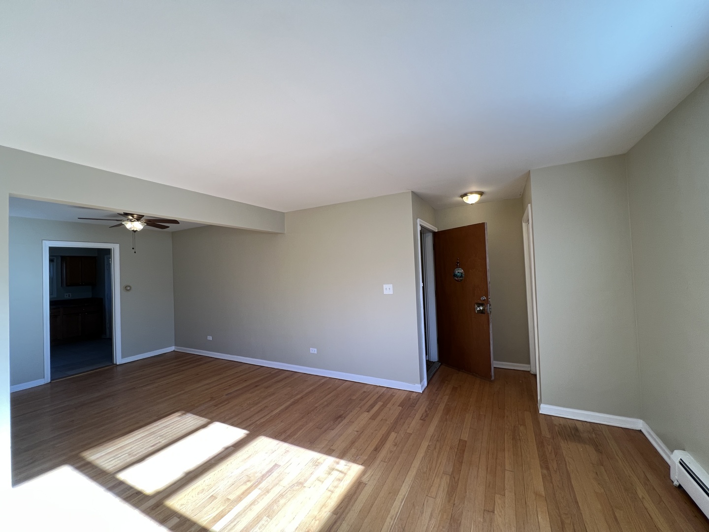 560 Princeton Street, Unit A2W Des Plaines, IL 60016 - Photo 6 of 15 a view of an empty room and window