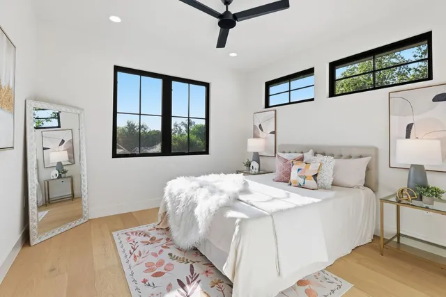 a bathroom with a double vanity sink toilet and shower