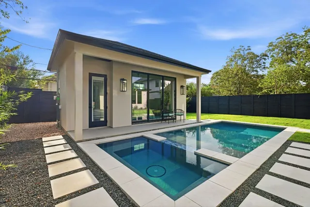 a view of swimming pool with seating area
