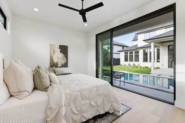 a bedroom with bed and window