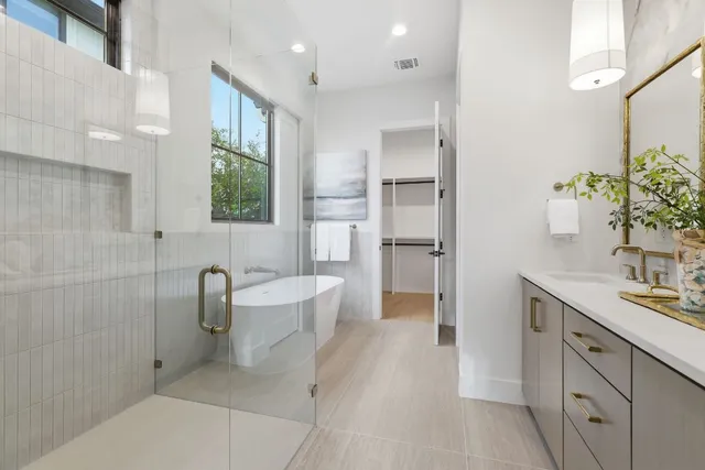 a spacious bathroom with a granite countertop sink a toilet and shower