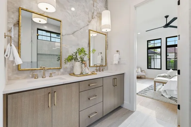 a spacious bathroom with a double vanity sink and a mirror