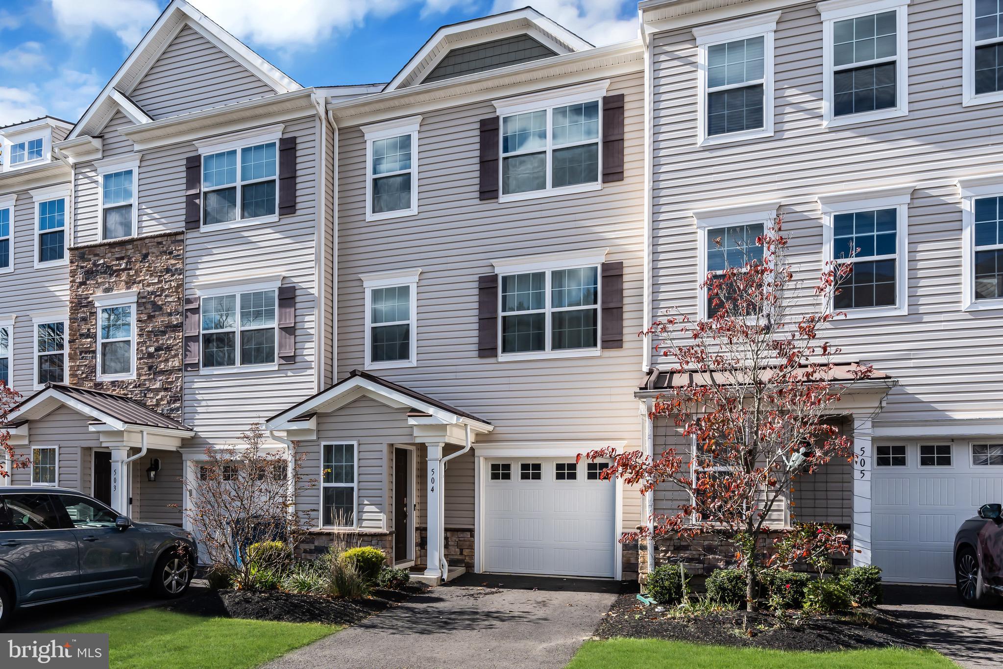 504 East International Road Monroe Township, NJ 08831 - Photo 1 of 37 a front view of a house with garden