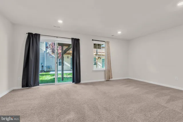 a view of livingroom with furniture and front door