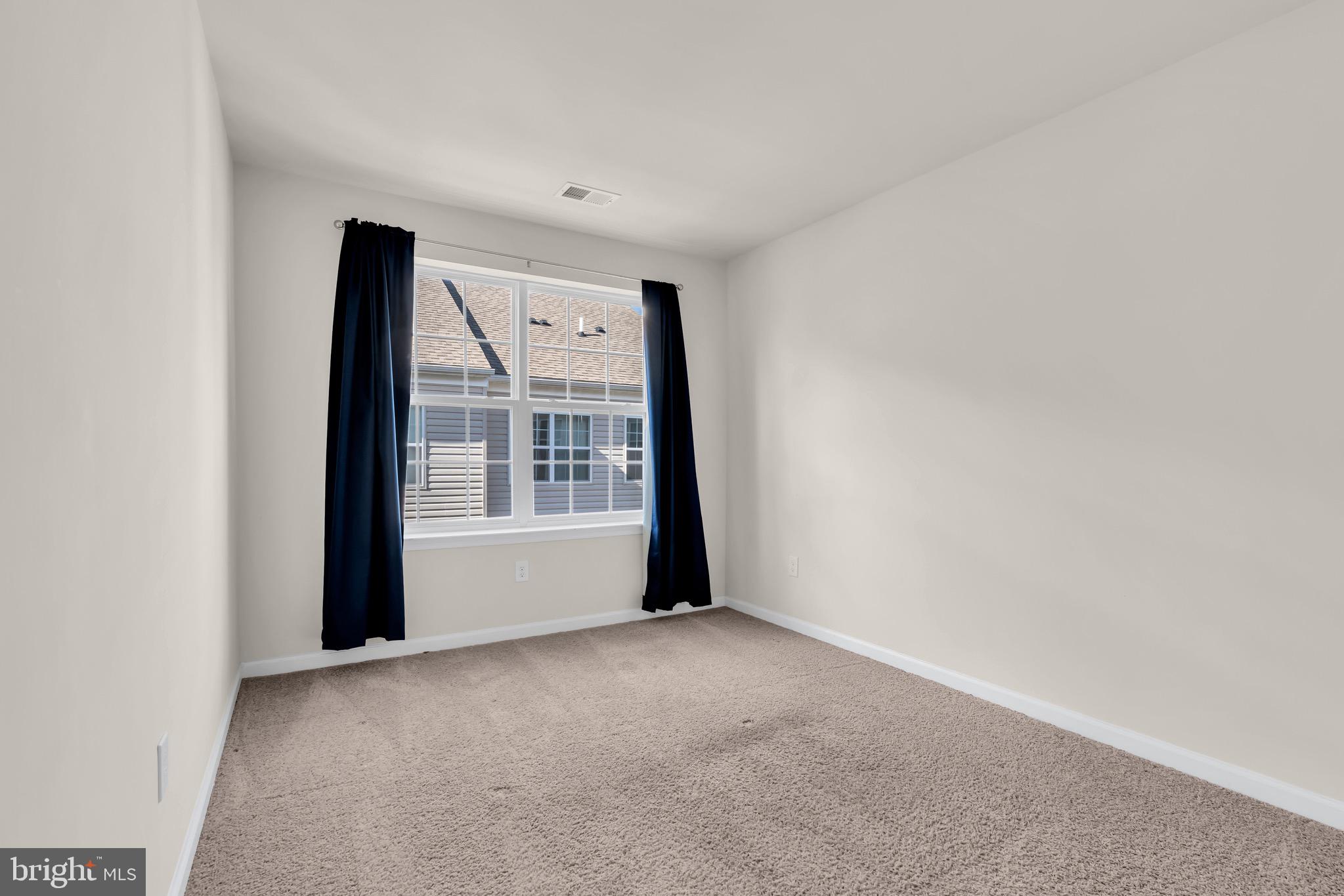 504 East International Road Monroe Township, NJ 08831 - Photo 18 of 37 a view of an empty room with a window