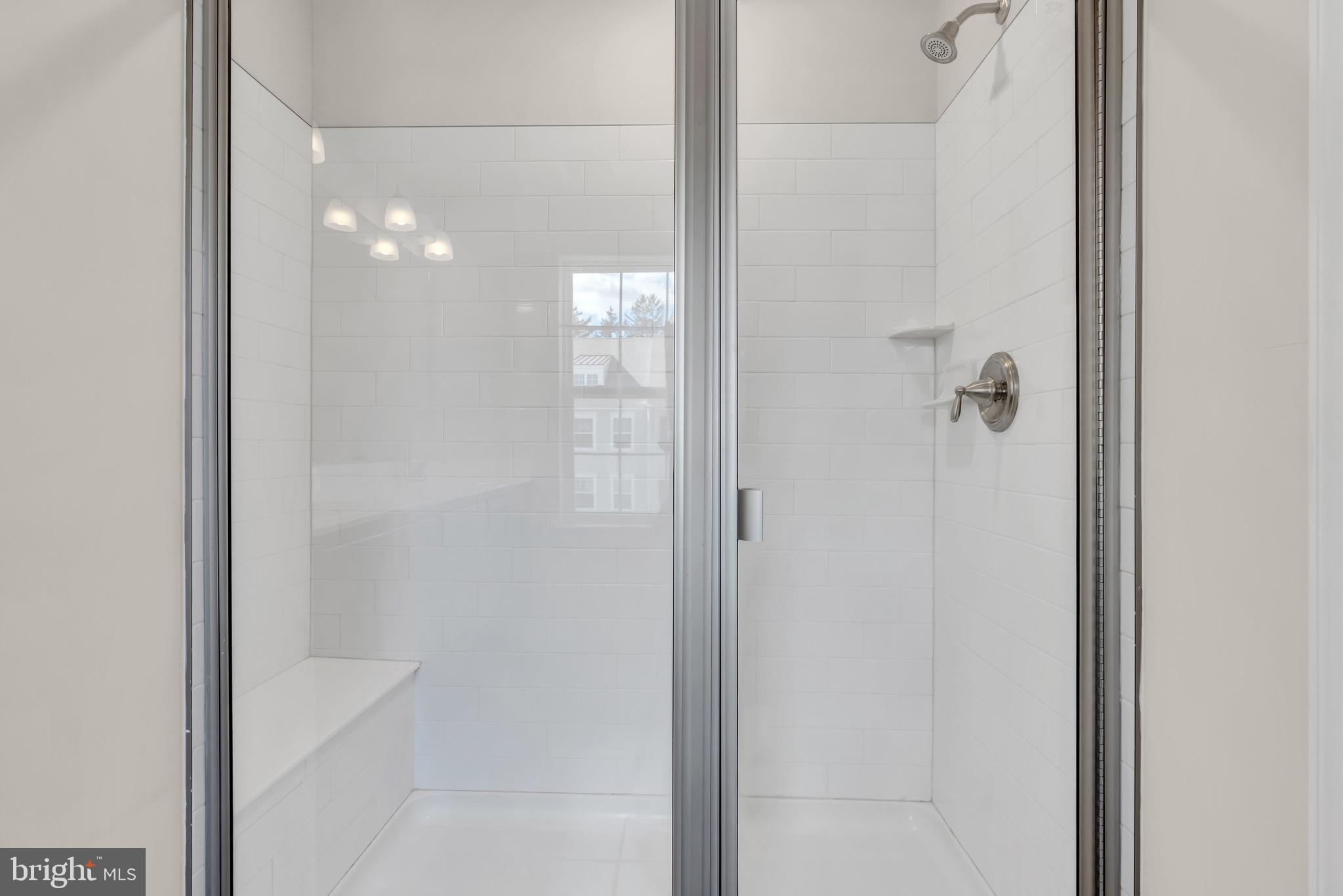 504 East International Road Monroe Township, NJ 08831 - Photo 21 of 37 a bathroom with a glass shower door