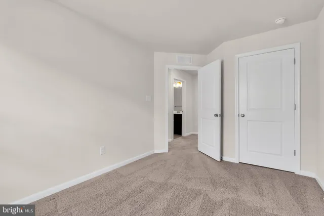 a bathroom with a bathtub sink vanity mirror and toilet
