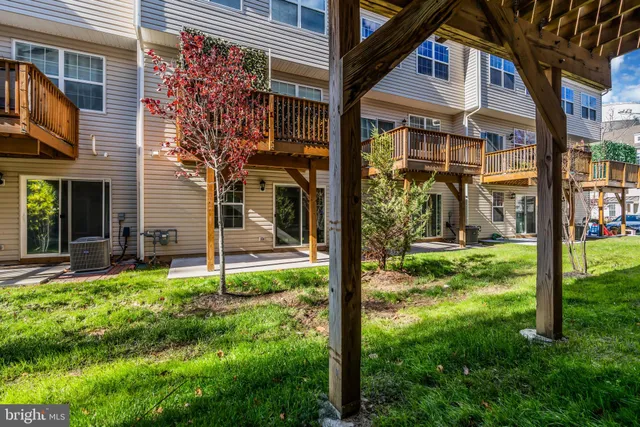 a front view of a building with a garden