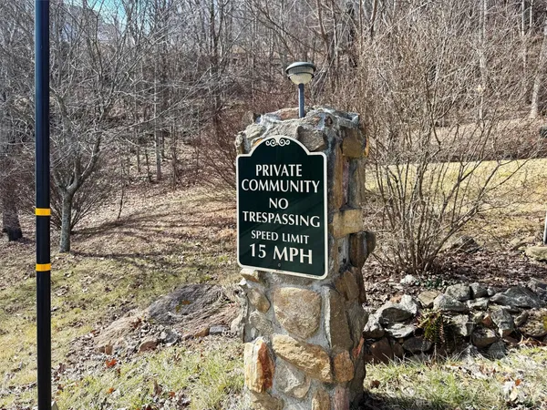 a view of outdoor space with a sign board