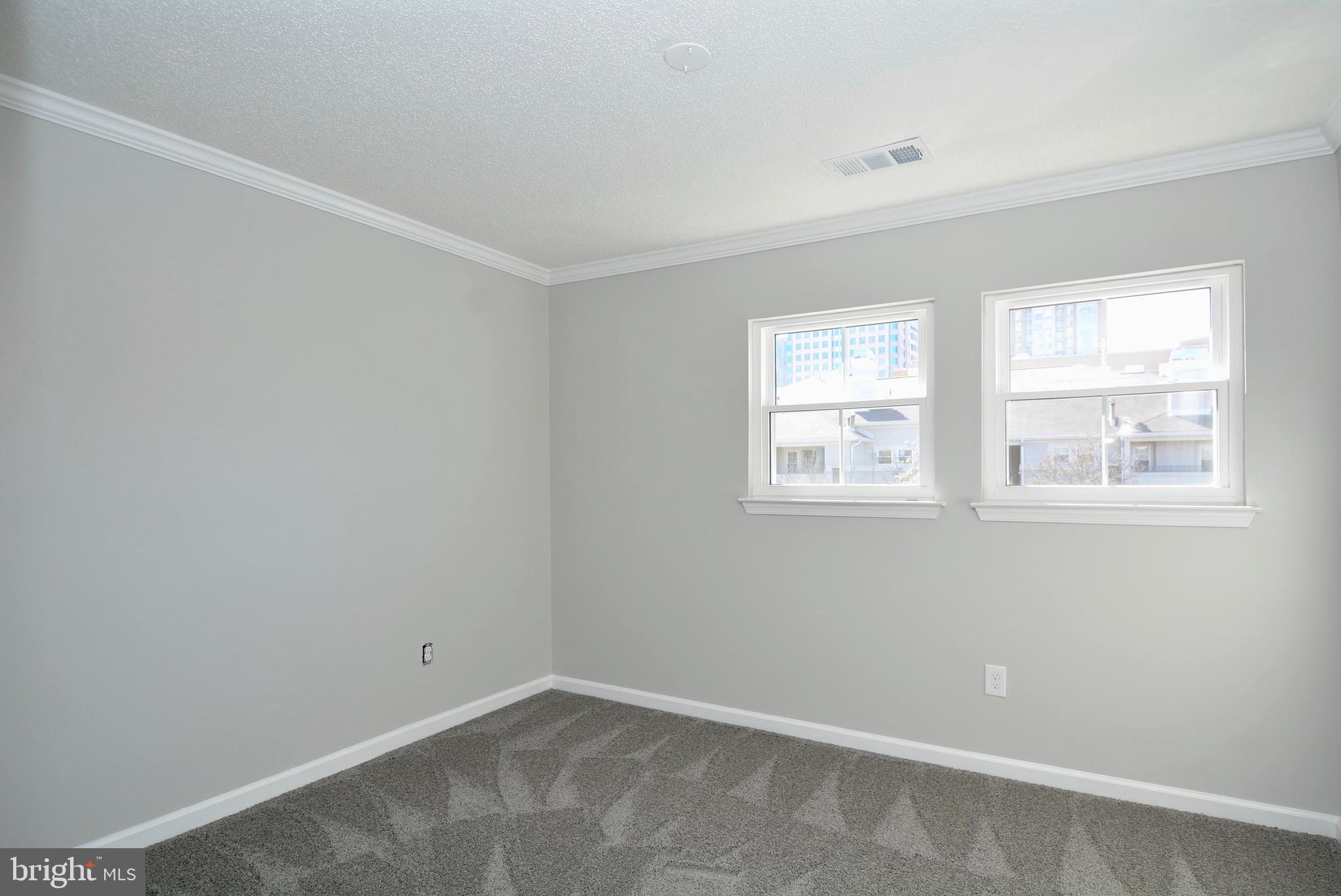 12000 Taliesin Place, Unit 36 Reston, VA 20190 - Photo 17 of 36 an empty room with windows