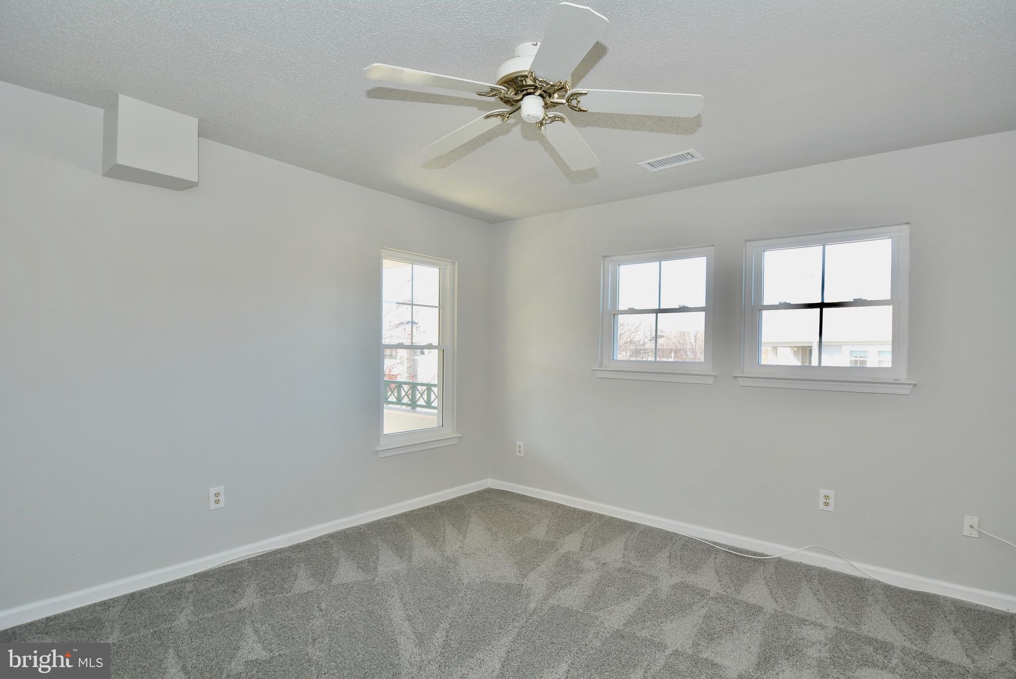 12000 Taliesin Place, Unit 36 Reston, VA 20190 - Photo 20 of 36 a view of an empty room with a window