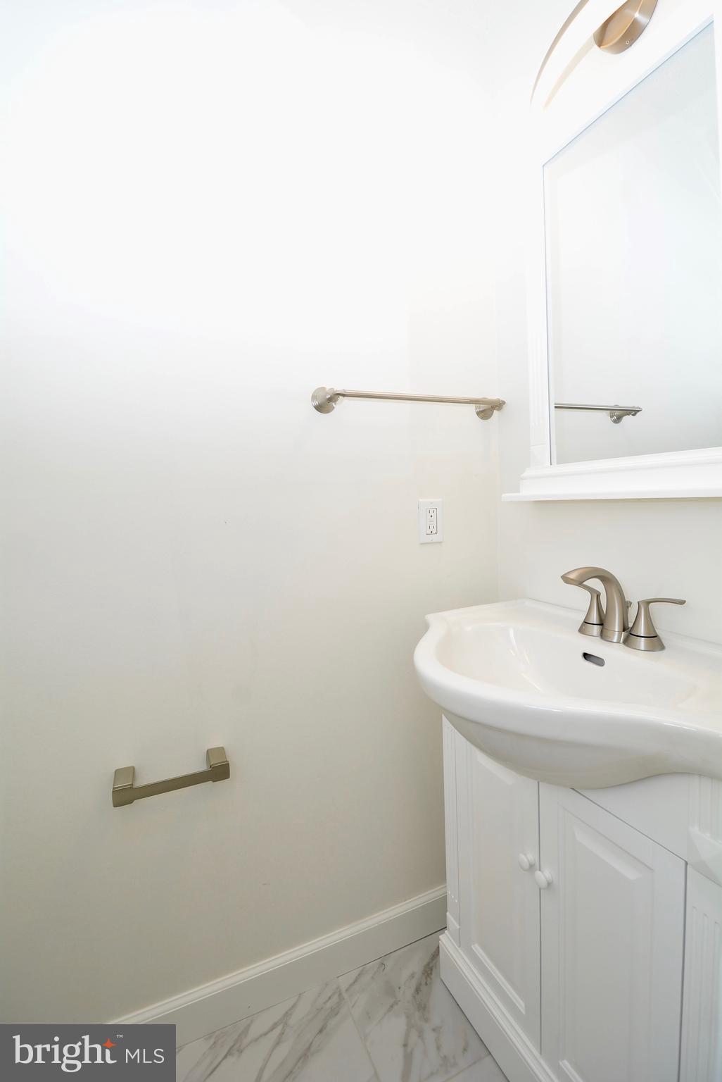 12000 Taliesin Place, Unit 36 Reston, VA 20190 - Photo 34 of 36 a bathroom with a sink and a vanity