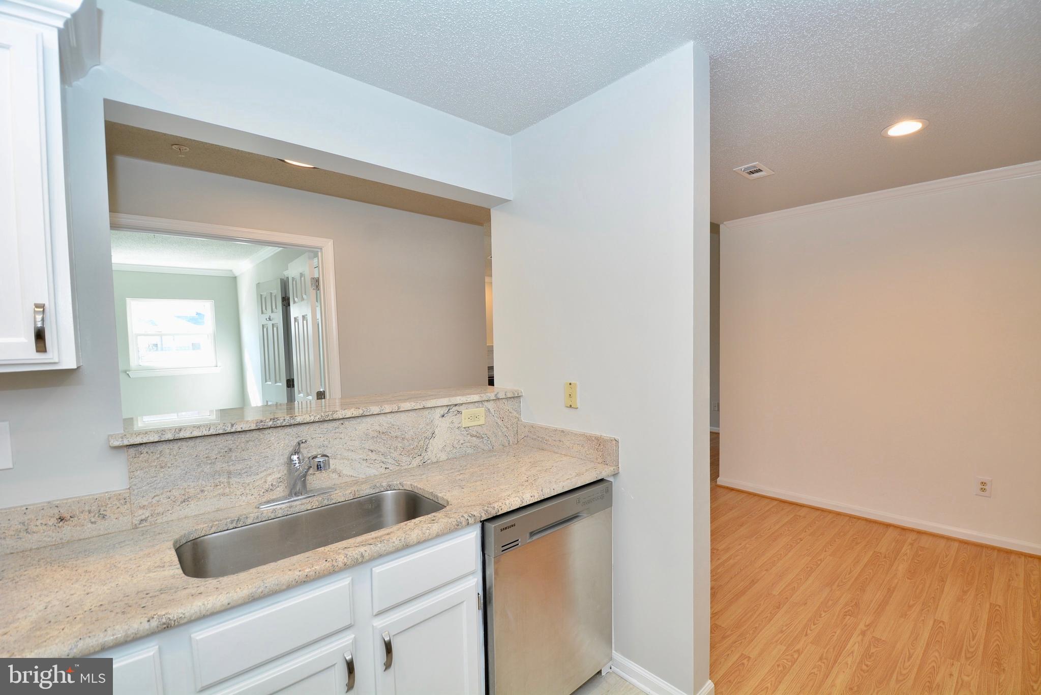12000 Taliesin Place, Unit 36 Reston, VA 20190 - Photo 8 of 36 a bathroom with a sink and a mirror
