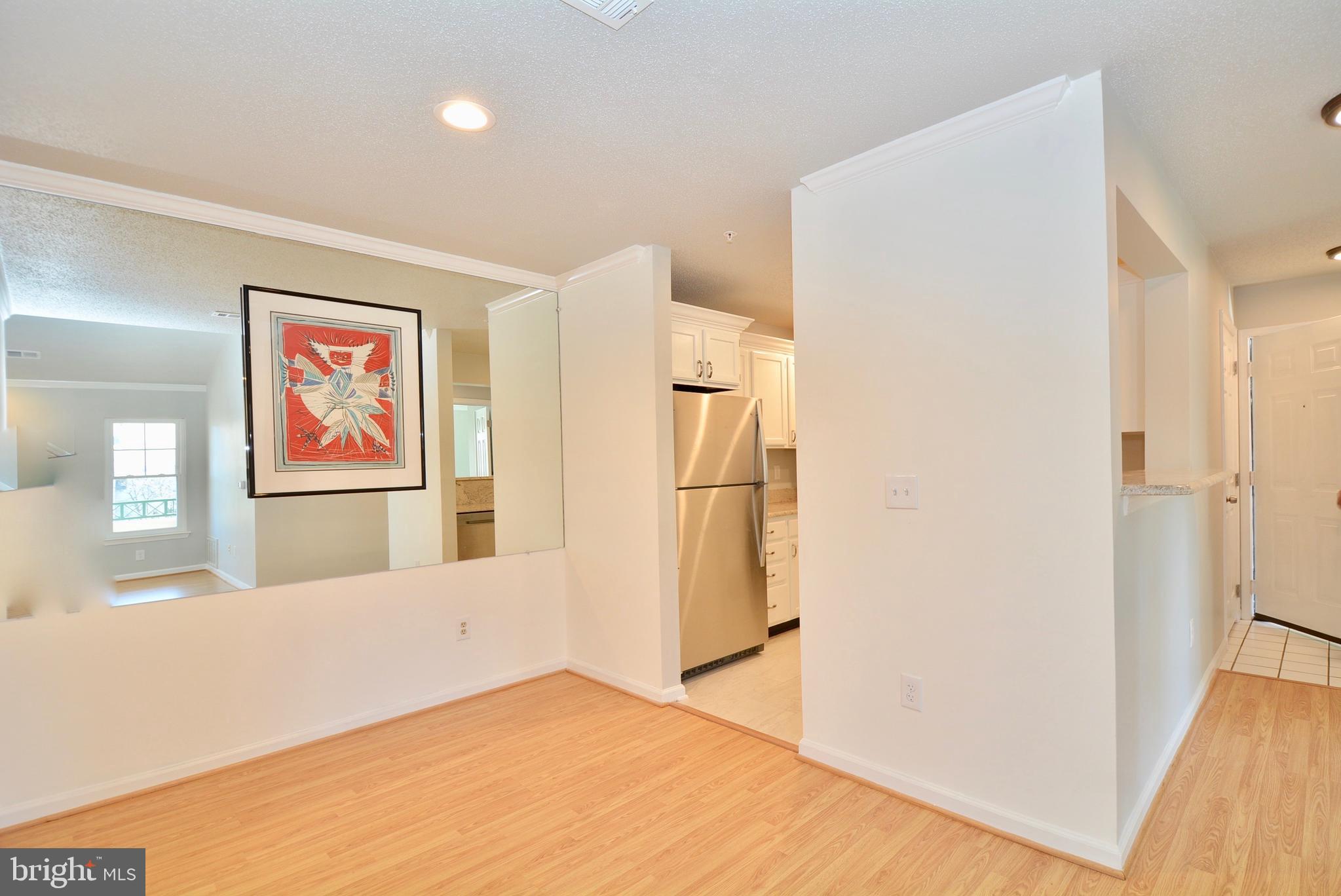 12000 Taliesin Place, Unit 36 Reston, VA 20190 - Photo 9 of 36 a view of a room with wooden floor and hallway