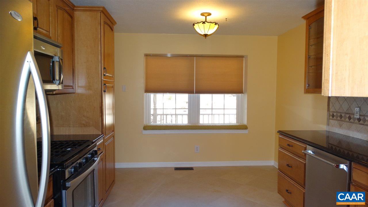 105 Old Farm Road Ruckersville, VA 22968 - Photo 5 of 34 a kitchen with granite countertop a refrigerator stove and microwave