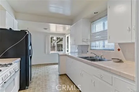 a kitchen with a sink and cabinets