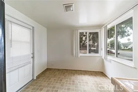 a view of an empty room and window