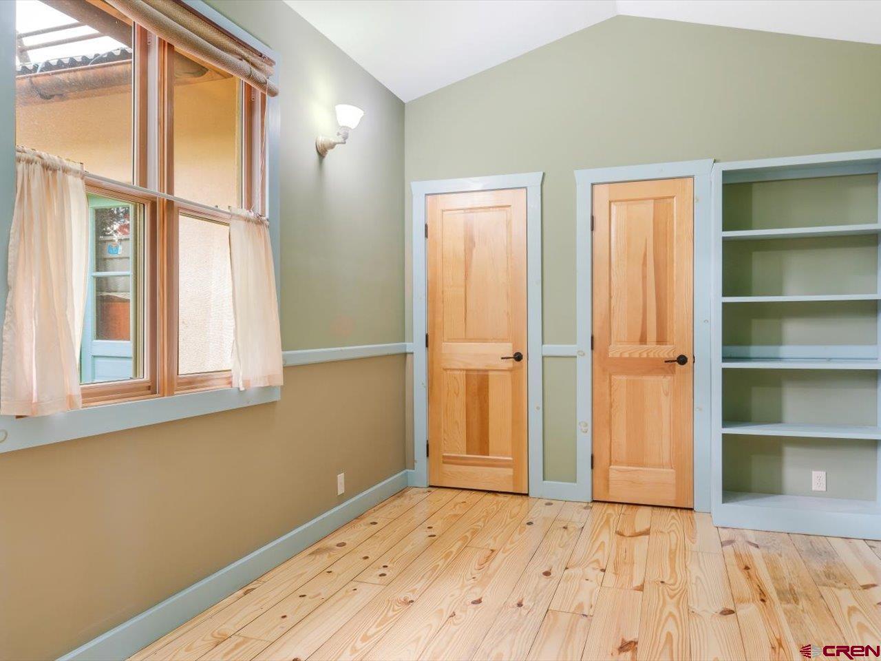 622 Bristlecone Drive Ridgway, CO 81432 - Photo 14 of 35 a view of an empty room with cabinet and a window
