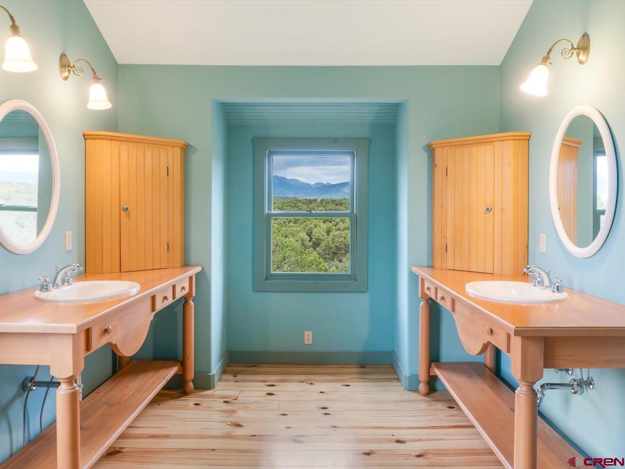 622 Bristlecone Drive Ridgway, CO 81432 - Photo 20 of 35 a bathroom with a sink mirror and a window