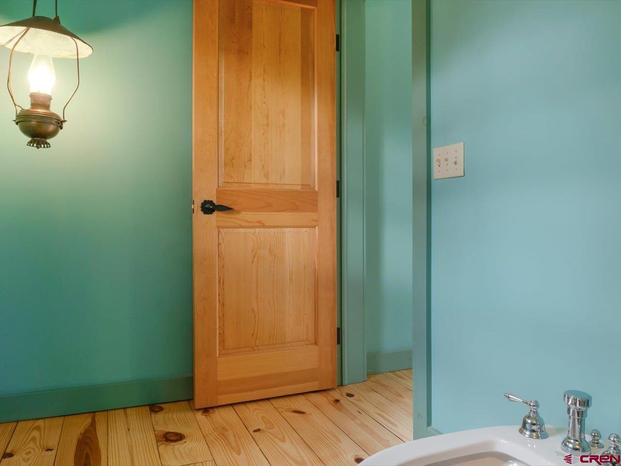 622 Bristlecone Drive Ridgway, CO 81432 - Photo 21 of 35 a bathroom with a sink and mirror
