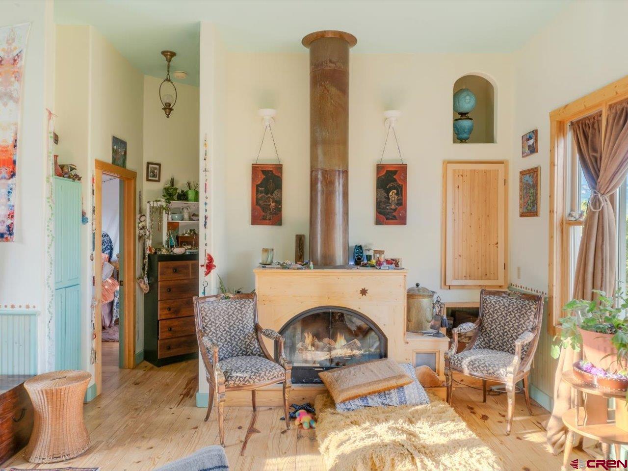 622 Bristlecone Drive Ridgway, CO 81432 - Photo 33 of 35 a living room with furniture and a fireplace