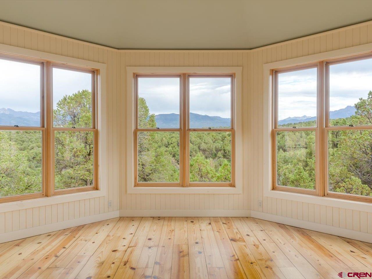 622 Bristlecone Drive Ridgway, CO 81432 - Photo 5 of 35 a view of an empty room with glass window and kitchen view