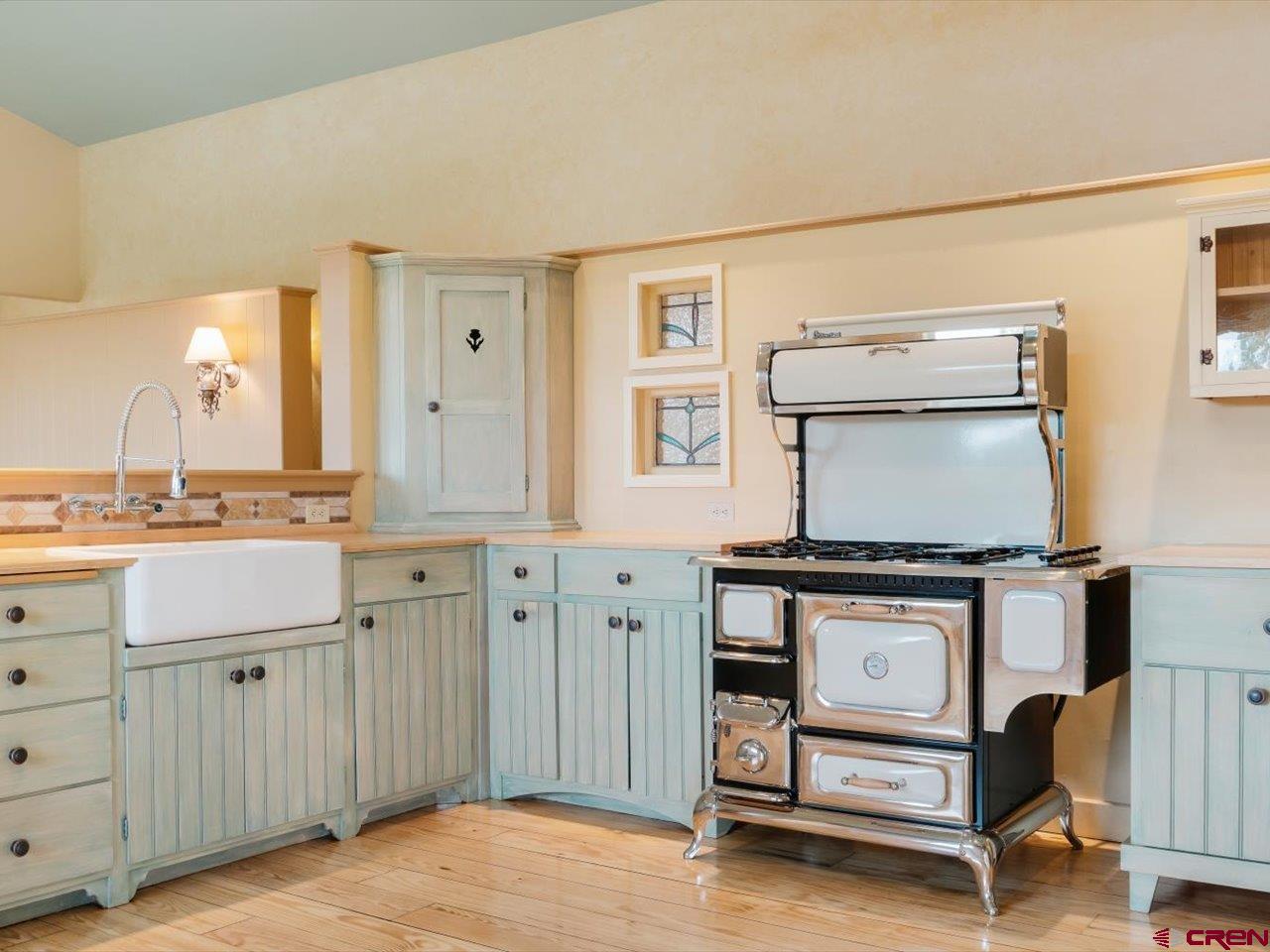 622 Bristlecone Drive Ridgway, CO 81432 - Photo 6 of 35 a kitchen with stainless steel appliances granite countertop a stove and a cabinets