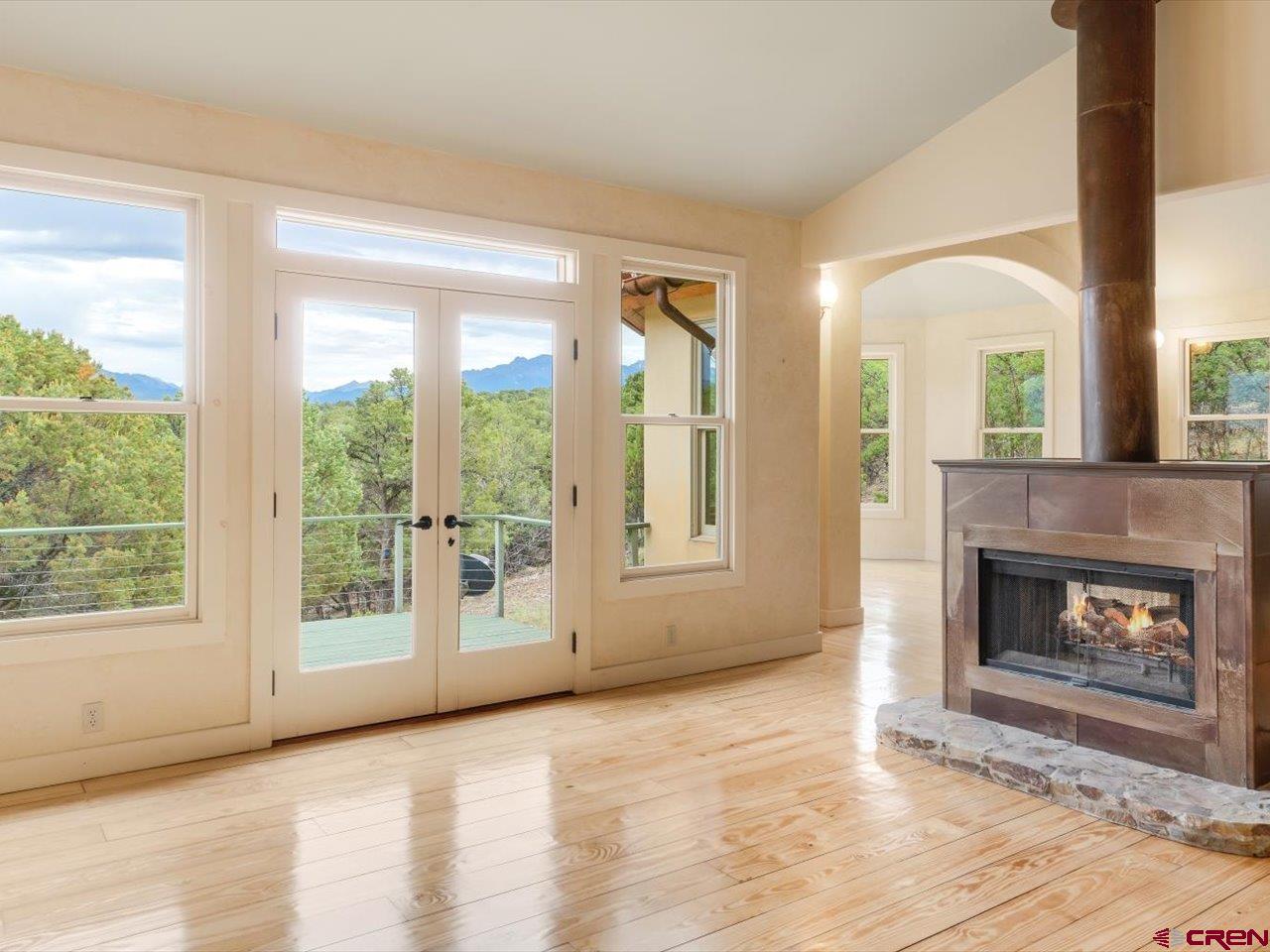 622 Bristlecone Drive Ridgway, CO 81432 - Photo 8 of 35 a view of an empty room with window and fire place