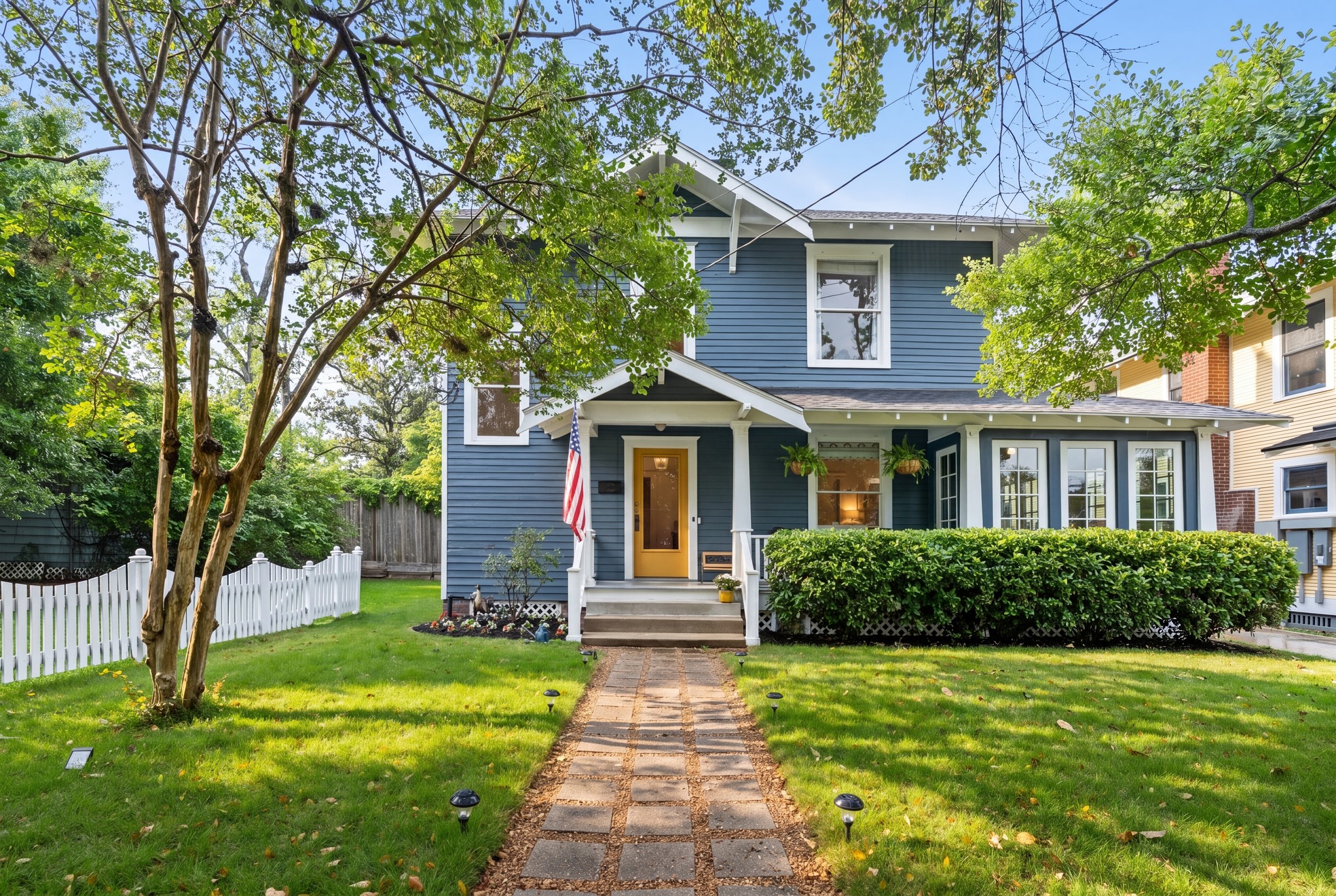 a front view of a house with garden