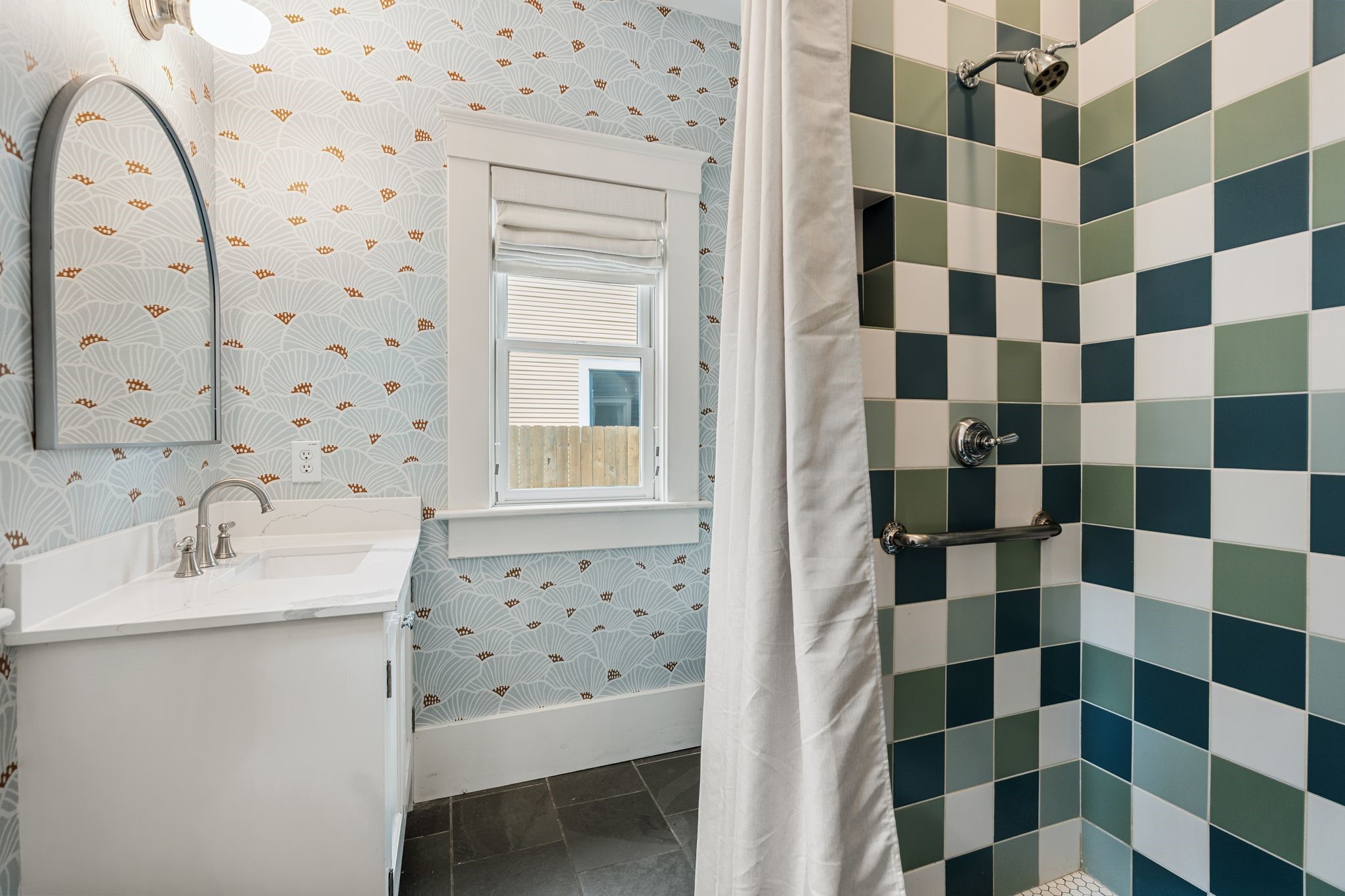 3012 Beauchamp Street Houston, TX 77009 - Photo 16 of 43 a bathroom with a sink shower and a mirror