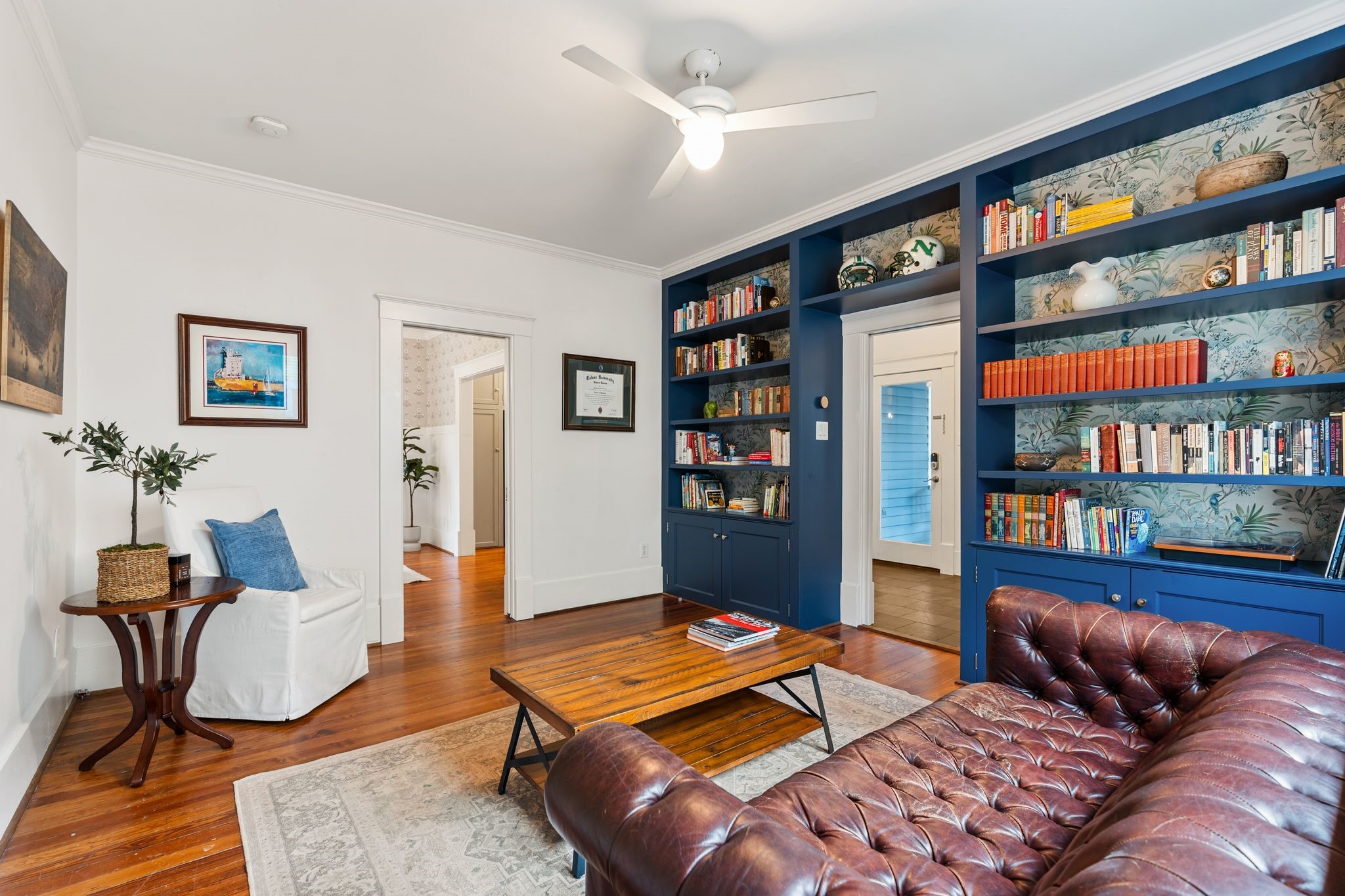 3012 Beauchamp Street Houston, TX 77009 - Photo 19 of 43 a living room with furniture a bookshelf and a book shelf