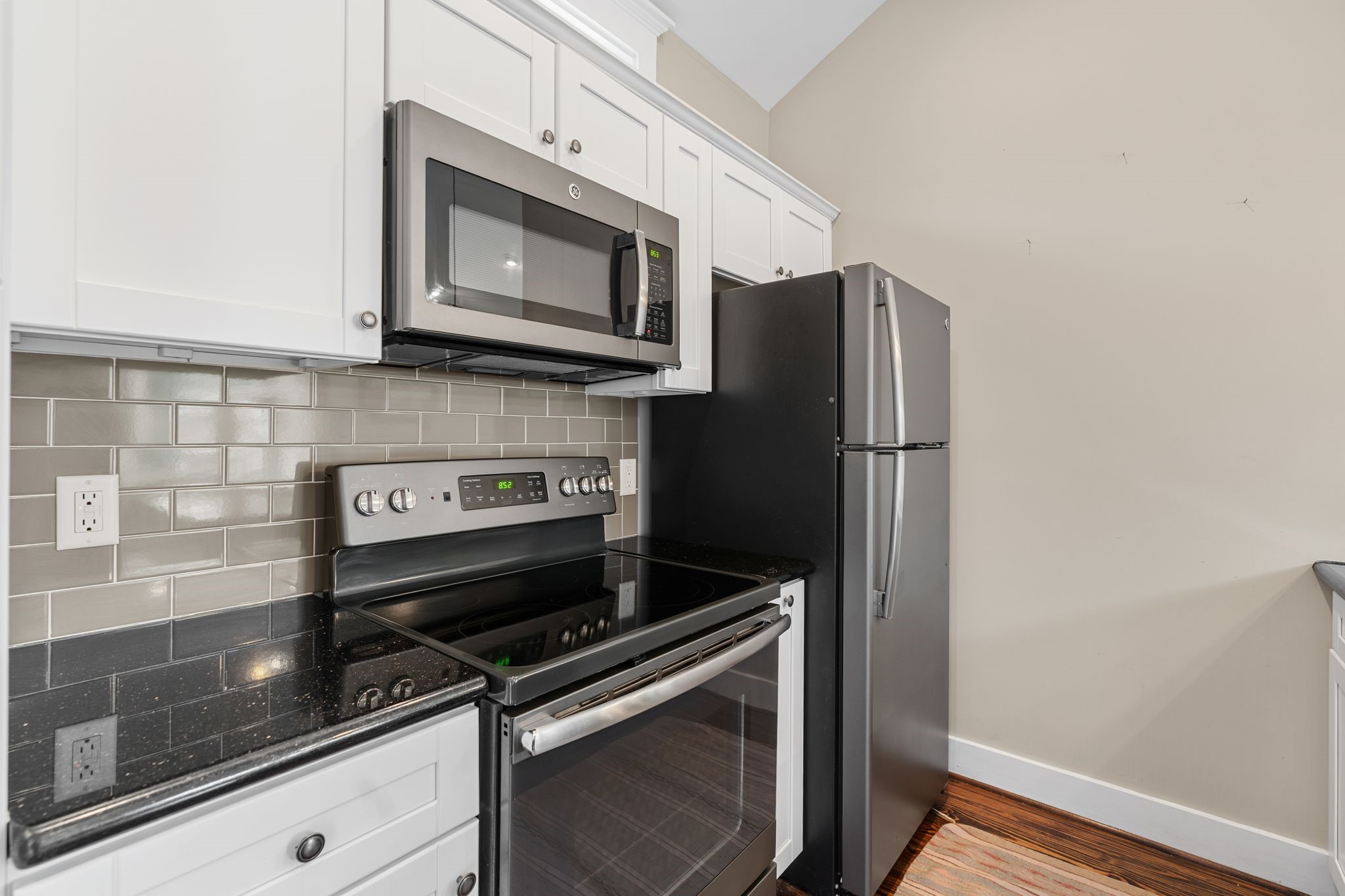 3012 Beauchamp Street Houston, TX 77009 - Photo 32 of 43 a kitchen with a refrigerator stove and microwave