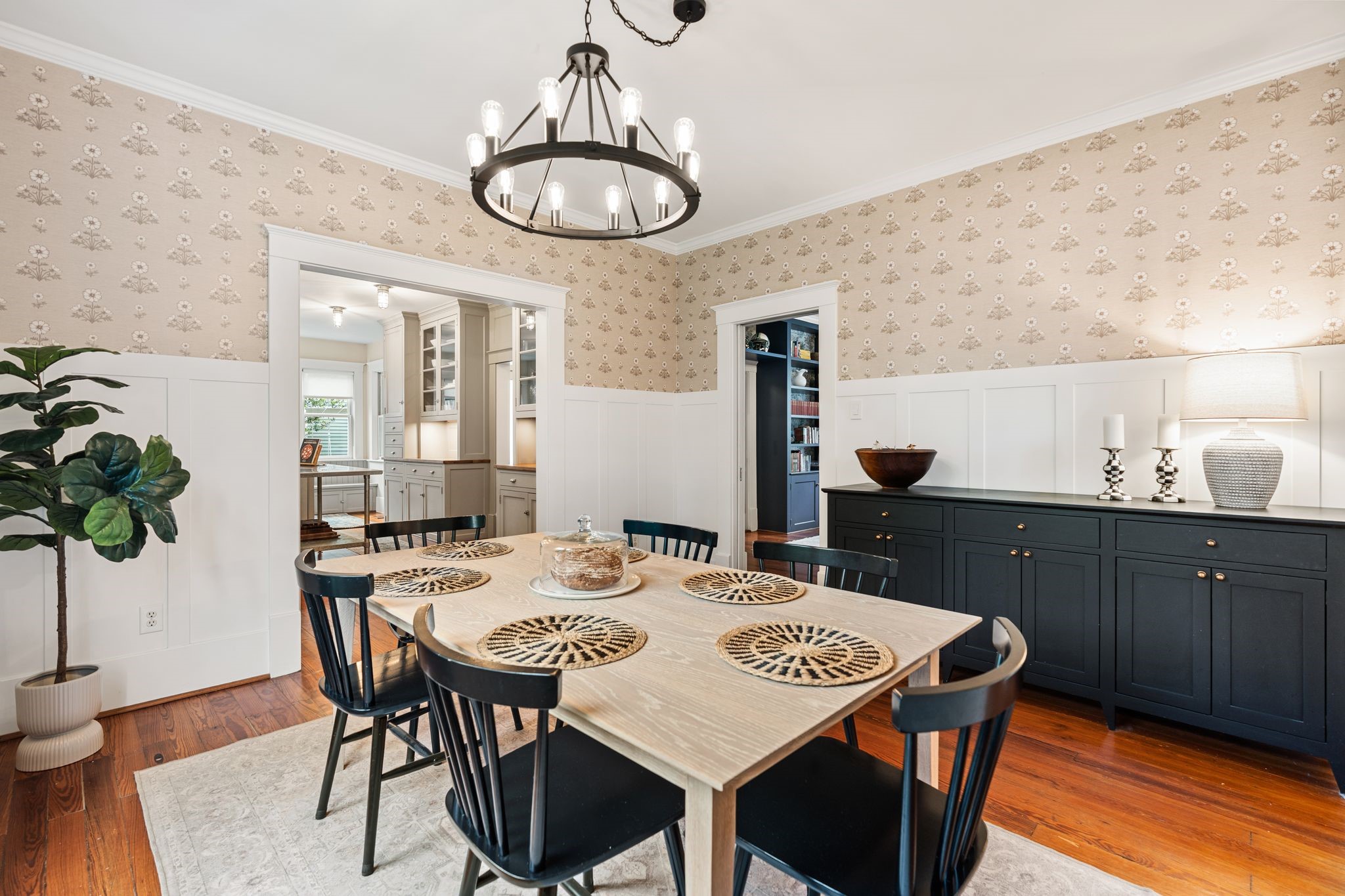 3012 Beauchamp Street Houston, TX 77009 - Photo 9 of 43 a view of a dining room with furniture wooden floor and chandelier